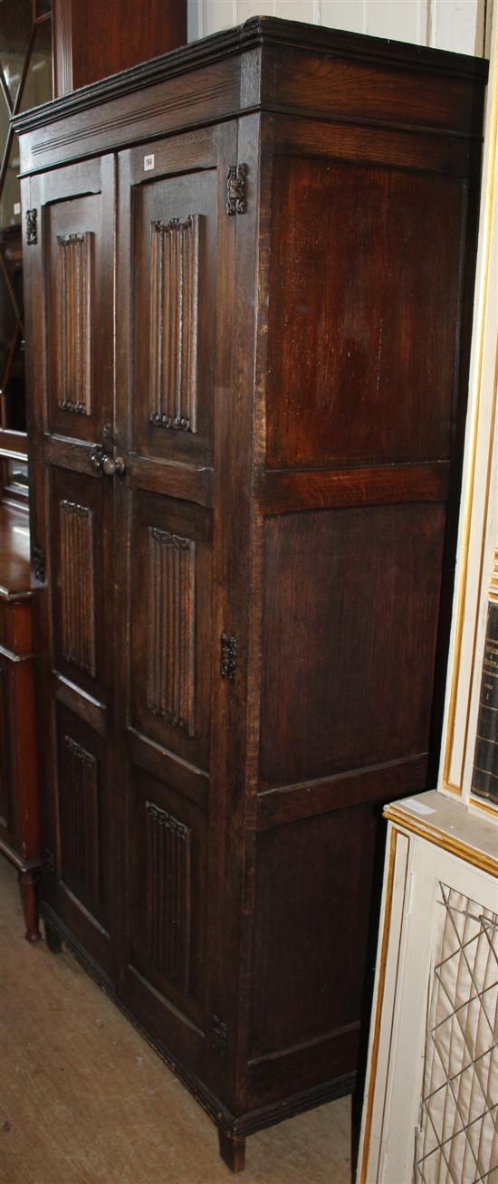 Oak linen fold cupboard